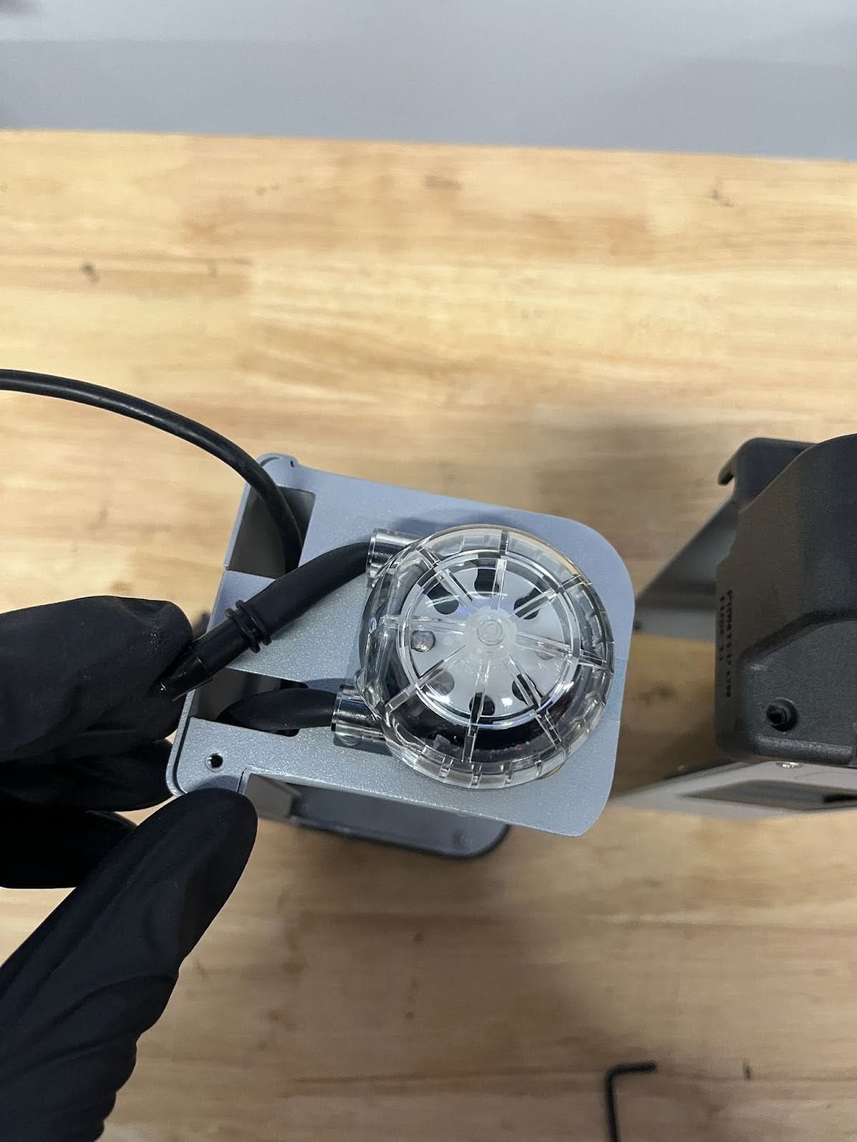 Set the screw and the strain relief aside.