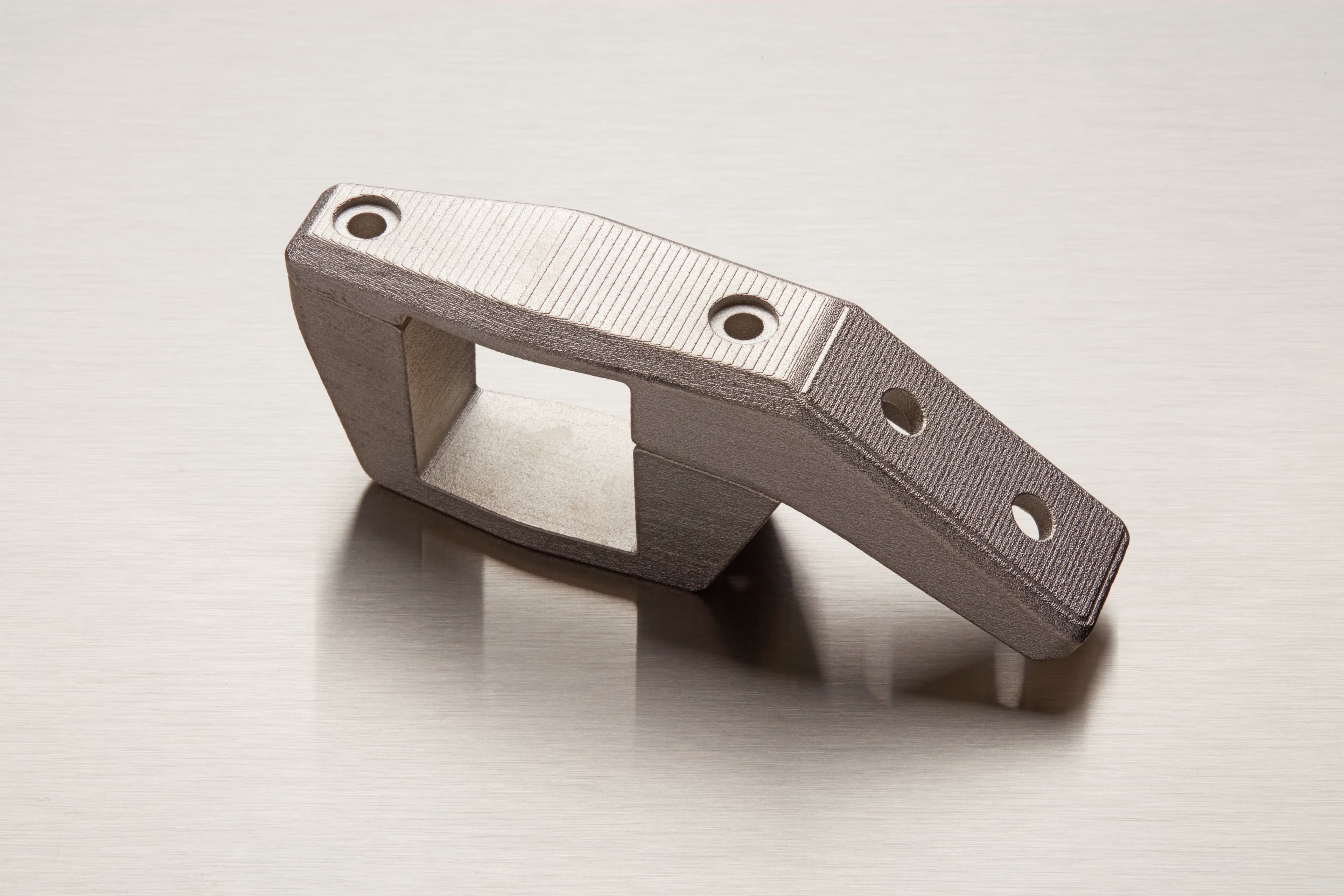 The surface texture of the Formlabs Nylon 12 substrate is visible through a structural nickel plate in this aero fairing prototype.