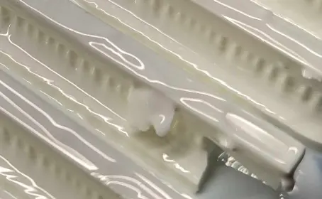 An example of debris left on the surface of a part printed in Alumina 4N Resin