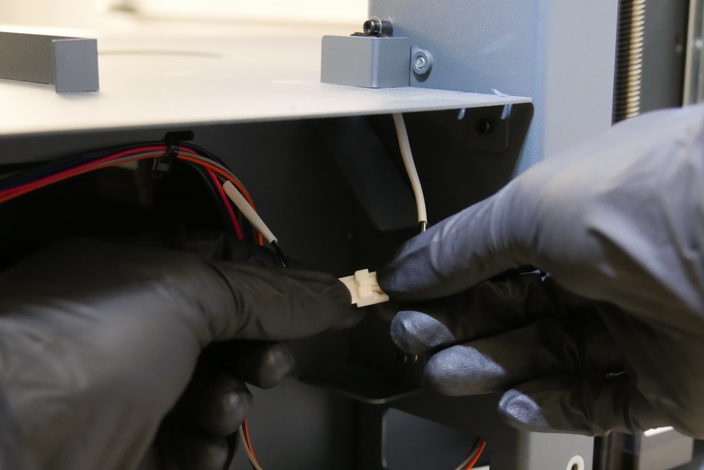 Disconnecting the wash bucket interlock switch cable