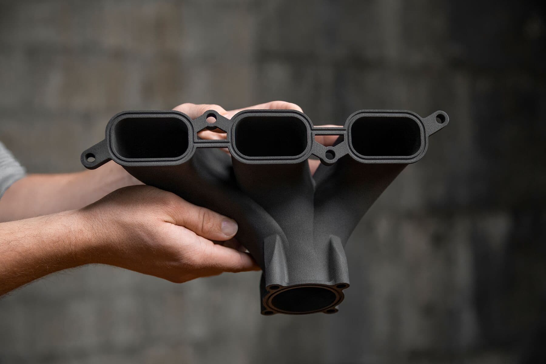 3D printed intake manifold in Nylon 11 CF powder on the Fuse 1+ 30W SLS printer