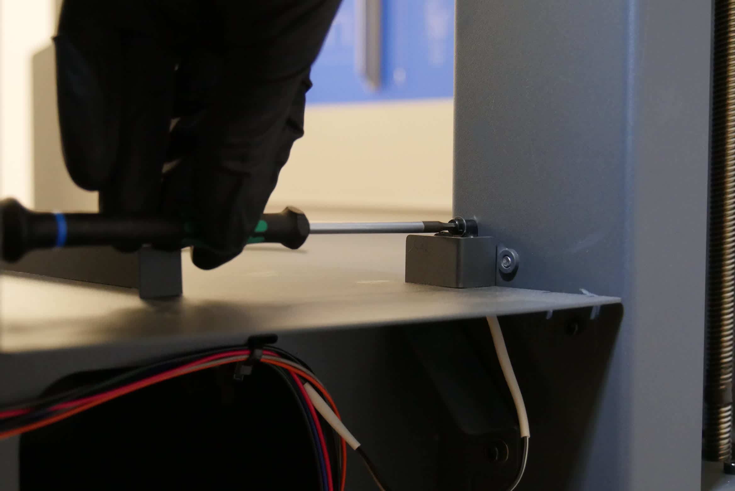 Removing the Form Wash L wash bucket interlock switch screw