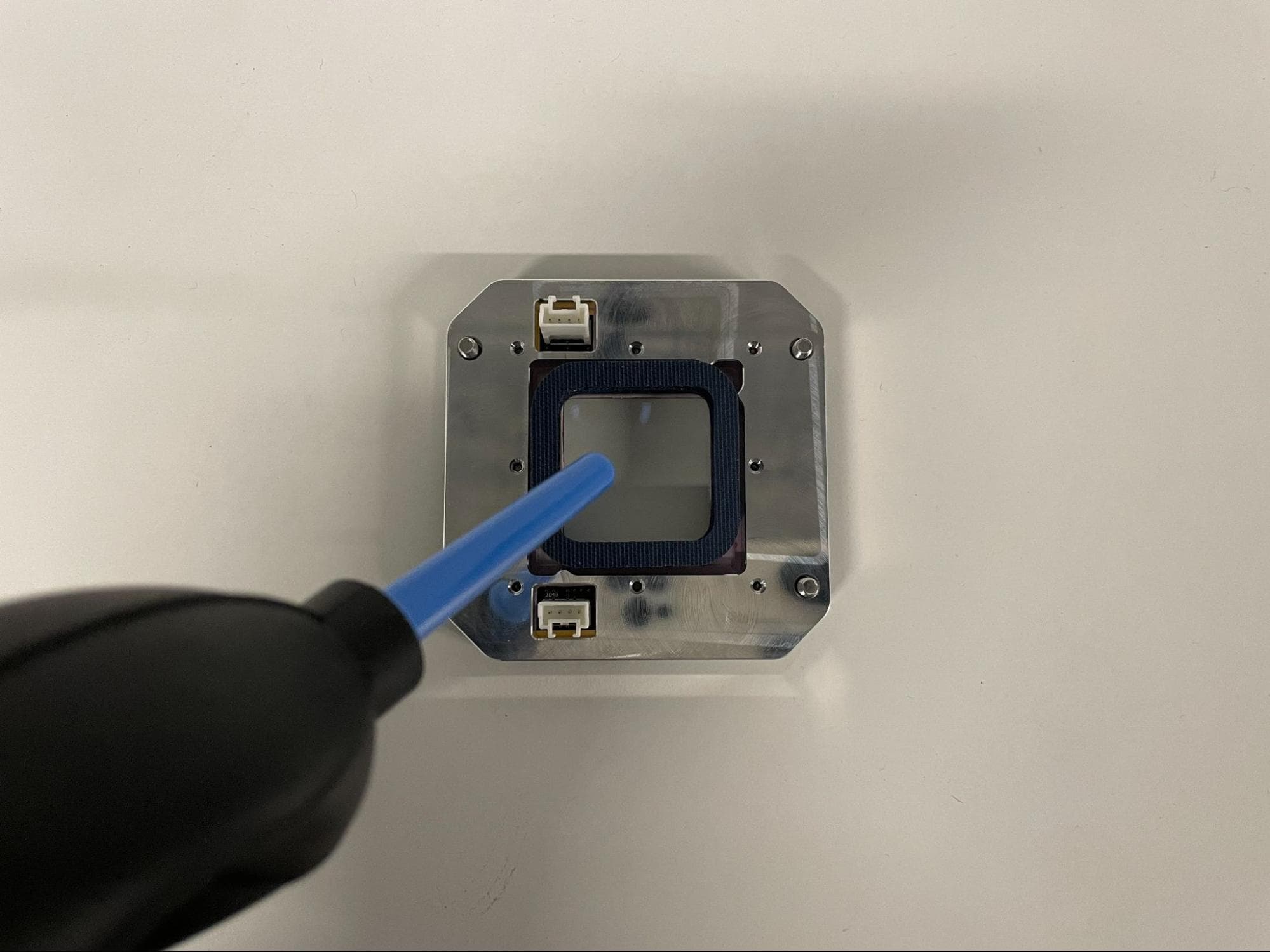 Install the new upper laser window