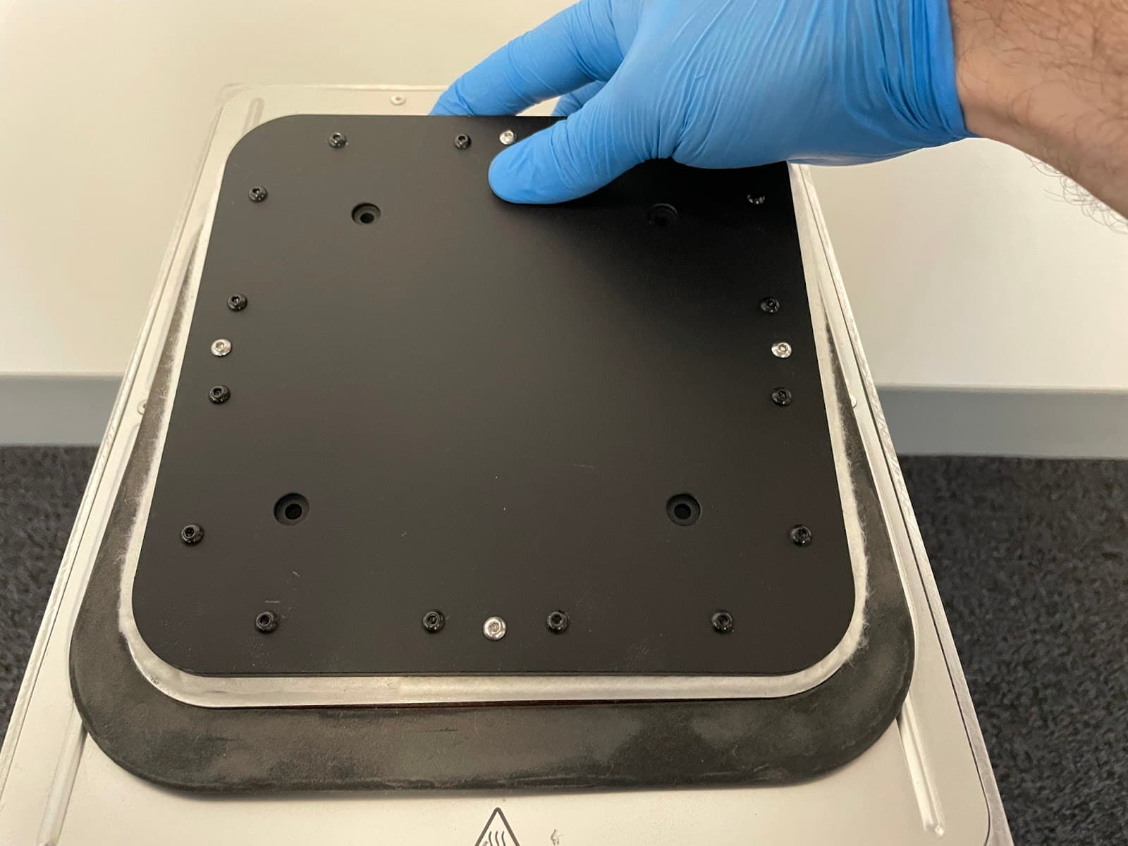 Pushing the print bed into the build chamber