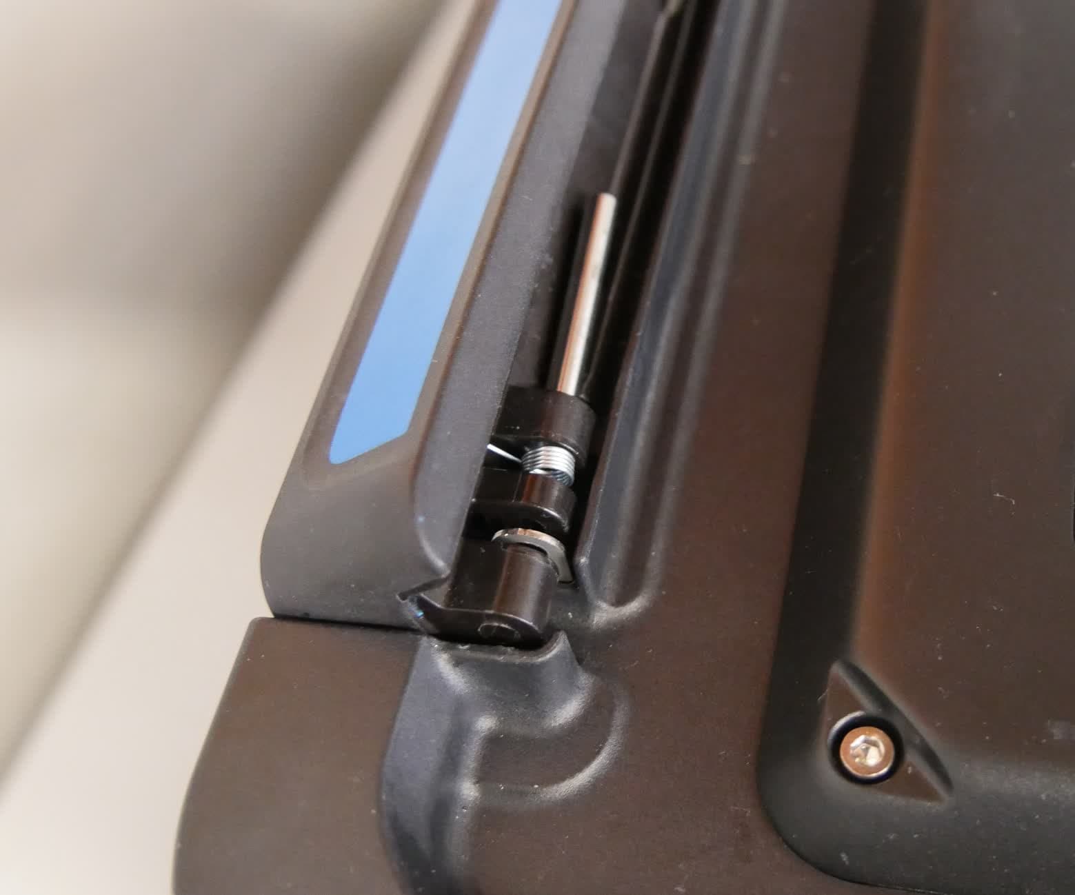Step 2: Remove the pin and spring