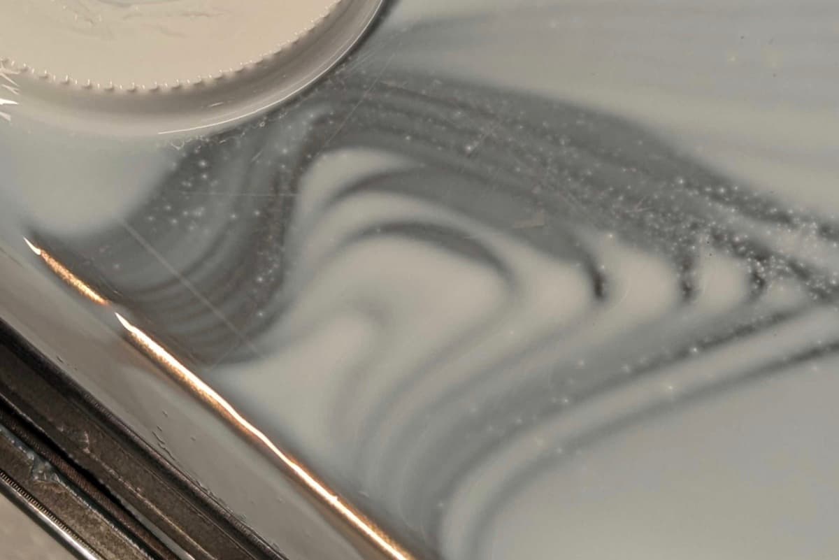 White particles in a tank of Alumina 4N Resin