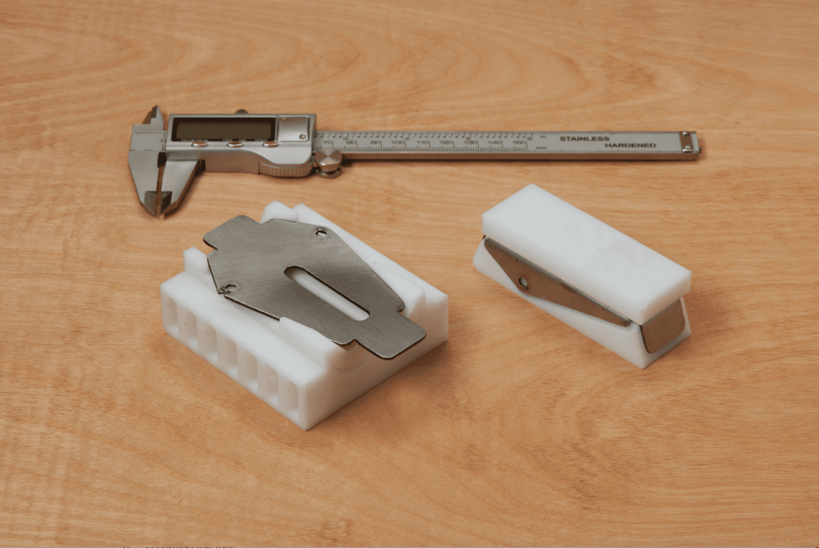The metal blank on top of the printed dies.