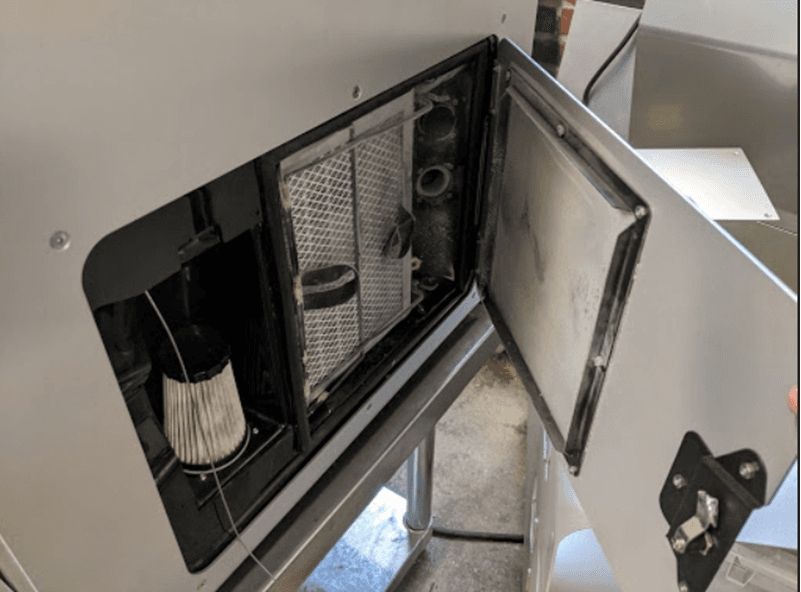 The cabinet door on the right side of the Fuse 1 is open