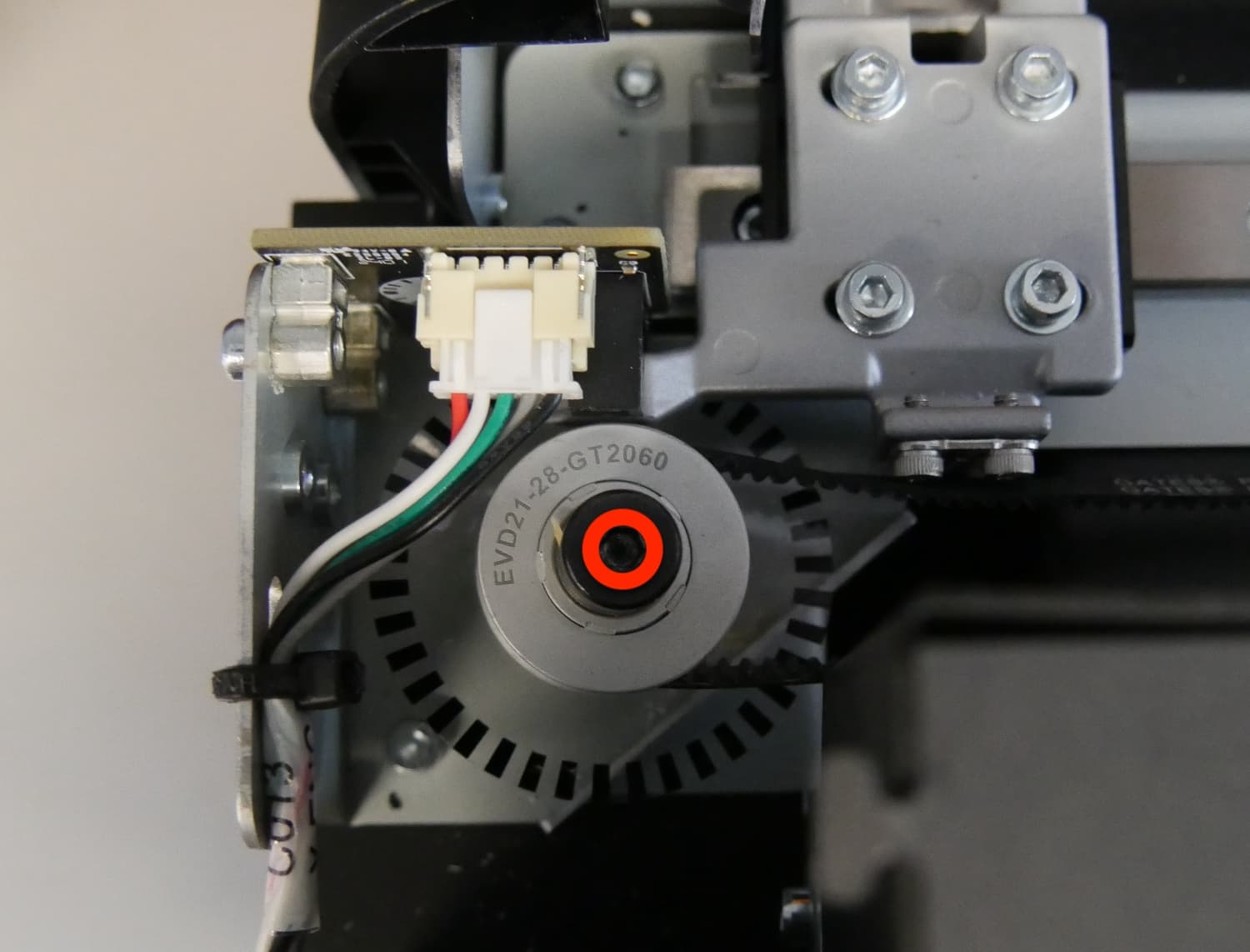 Step 2: Remove the mixer idler pulley and encoder wheel assembly