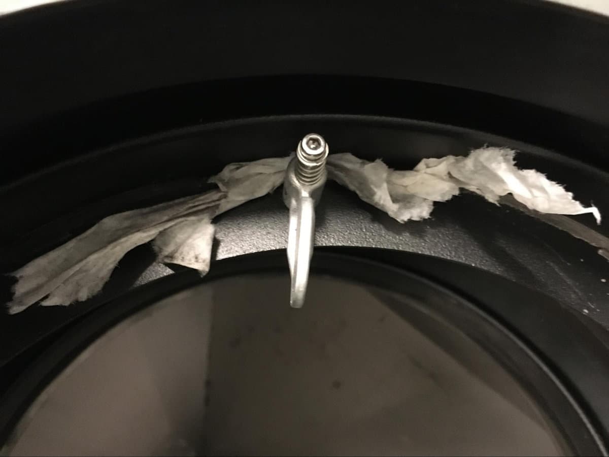 Cleaning behind each turnbuckle with a paper towel