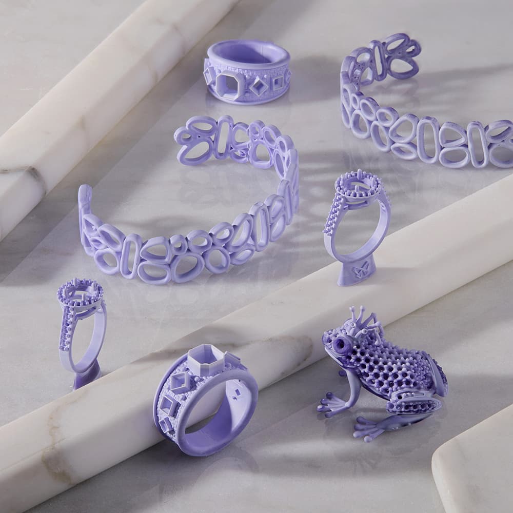 Bracelets, rings, and a small frog prince printed in True Cast Resin