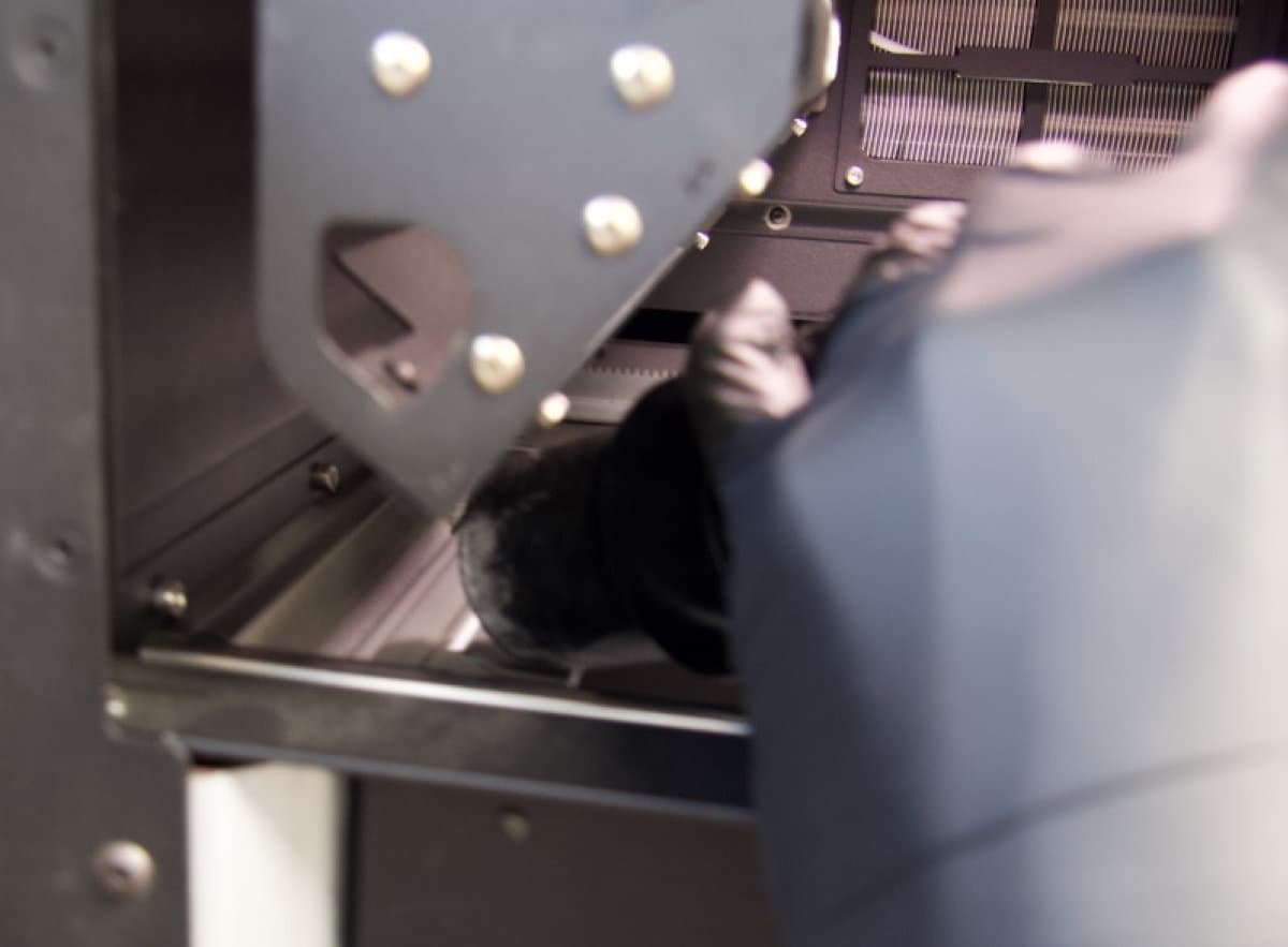 Vacuuming the left powder trough