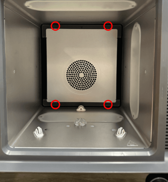 Remove the heater cover panel screws