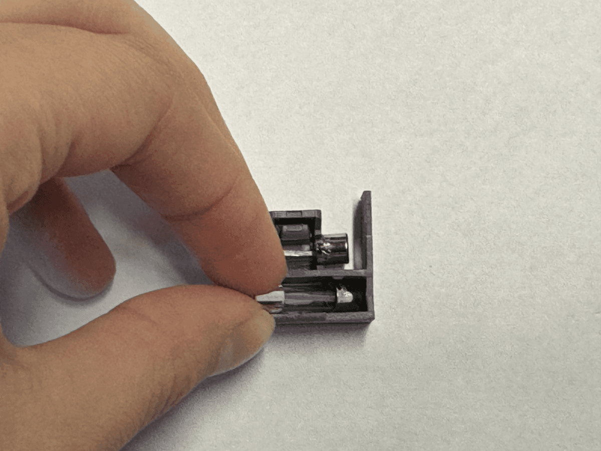 Using a flathead screw driver, gently pry the blown fuse from the fuse box.