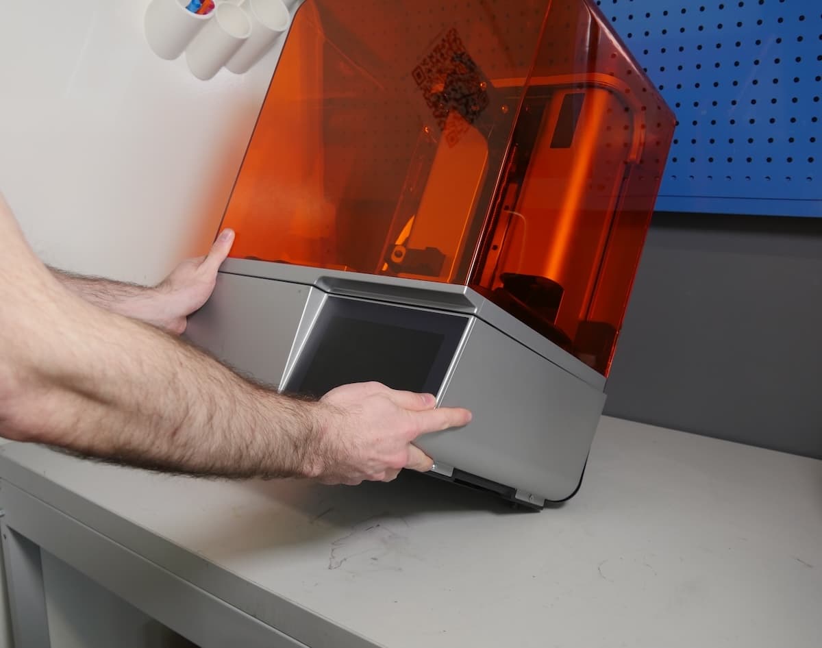 Tilting the Form 4 printer onto its back