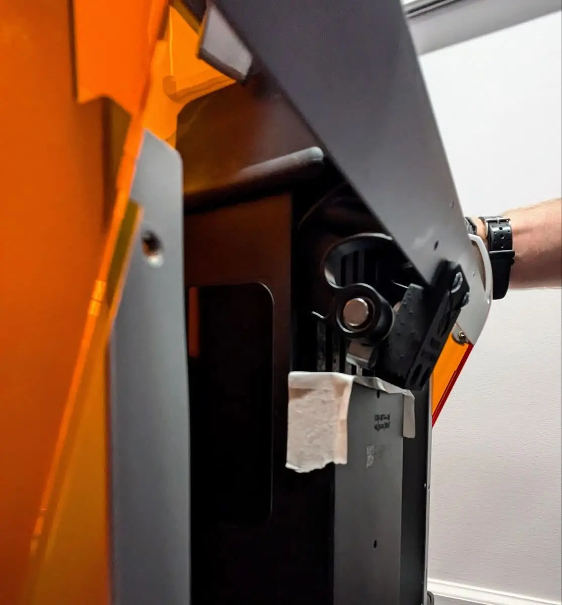 Rotating the Form 4 cover closed onto the printer