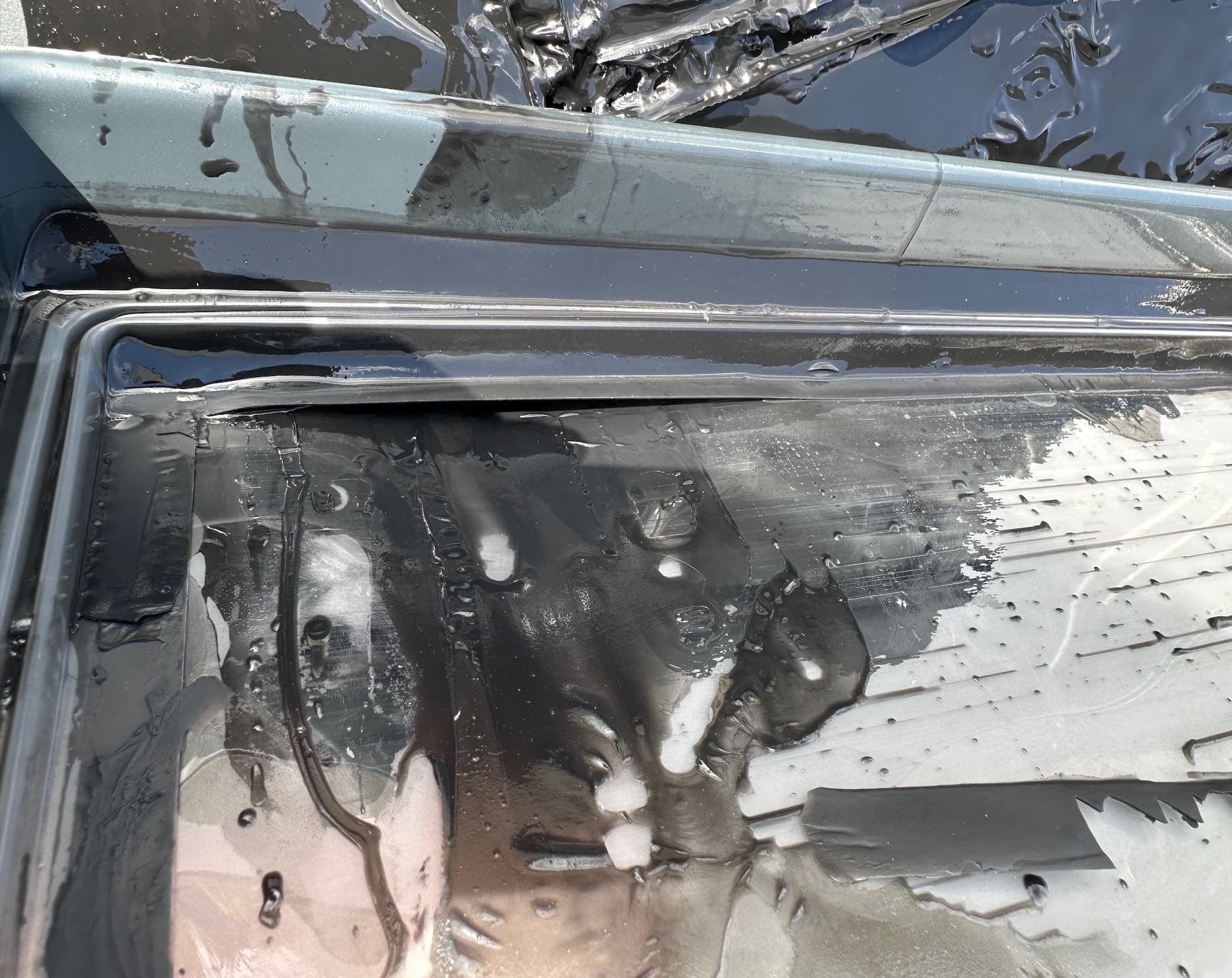 Resin spill due to VHB tape separation