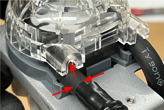 Ensure that the pump tube is not pinched between the pump cap and the pump body.