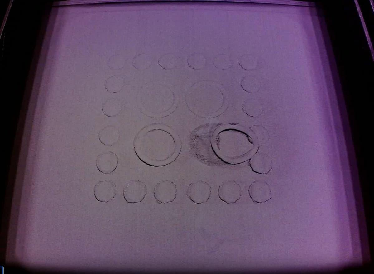 Curled layer caught and dragged by the recoater roller