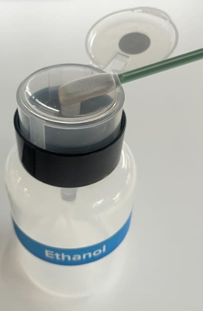 Ethanol is being applied to a swab