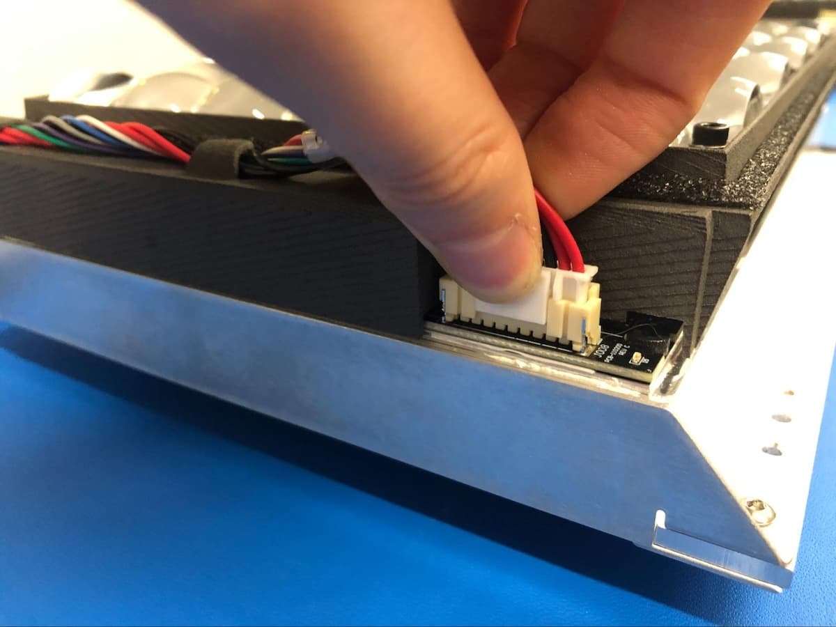 Unplugging the Form 4 backlight driver cable