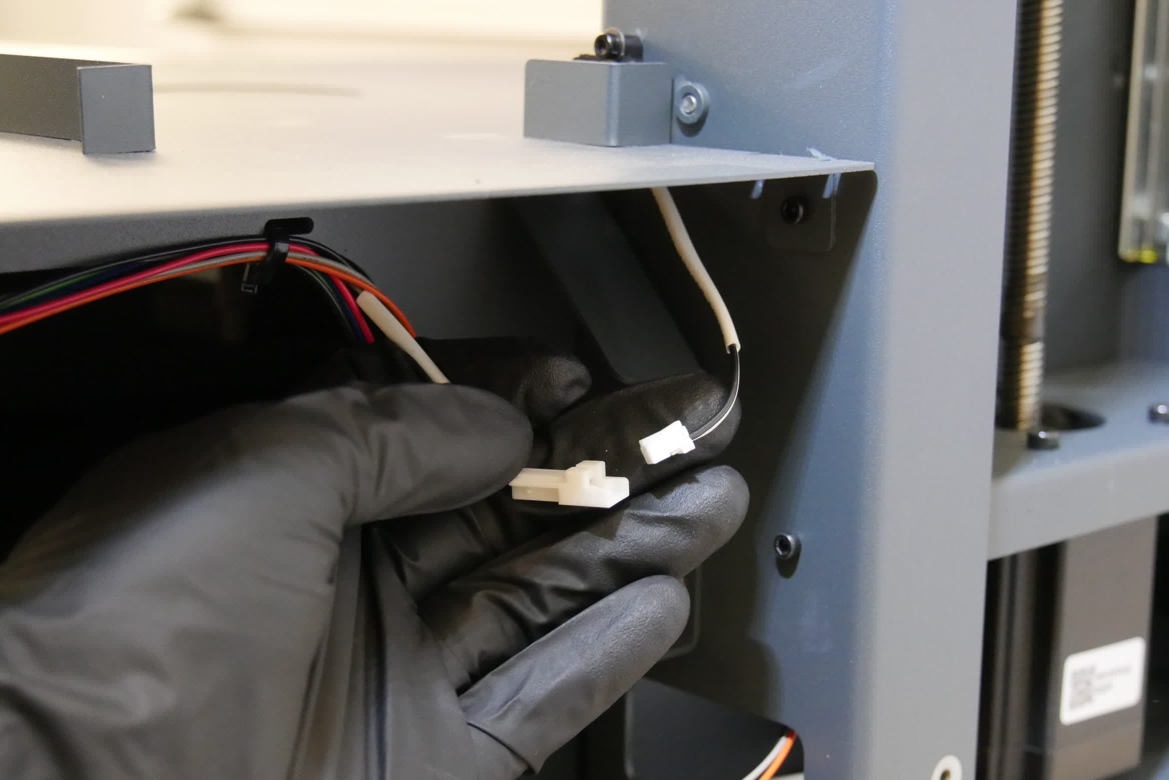 Disconnecting the wash bucket interlock switch cable