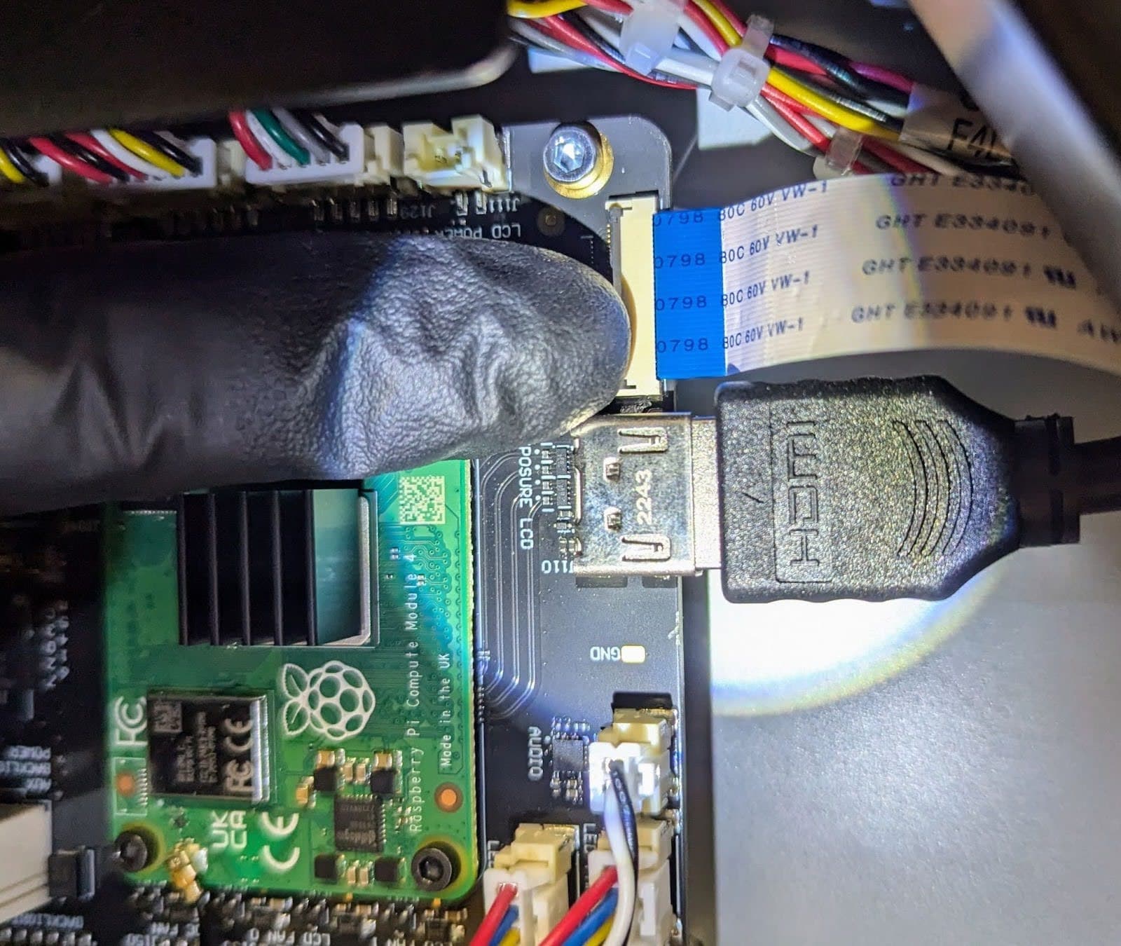 Disconnect the touchscreen ribbon cable from the motherboard