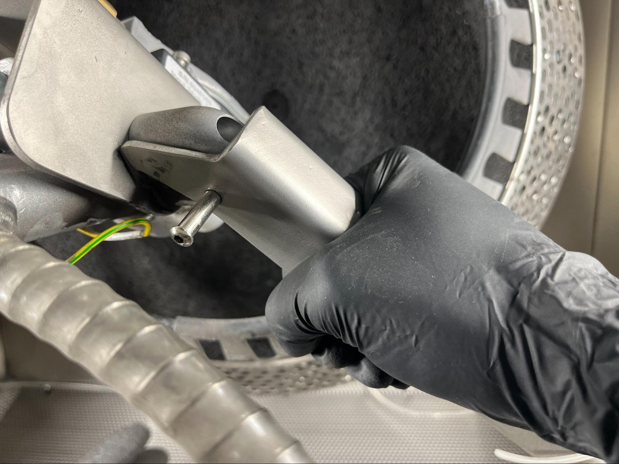 Installing the binding barrel through the Fuse Blast handle and blast arm
