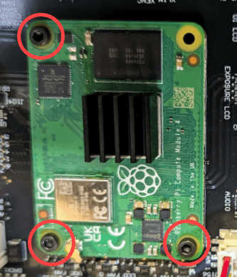 Secure the SOM to the motherboard