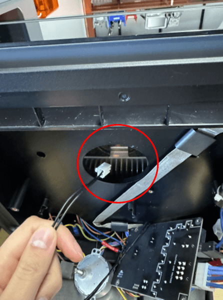 Remove the motor cable through the opening in the bottom shell.
