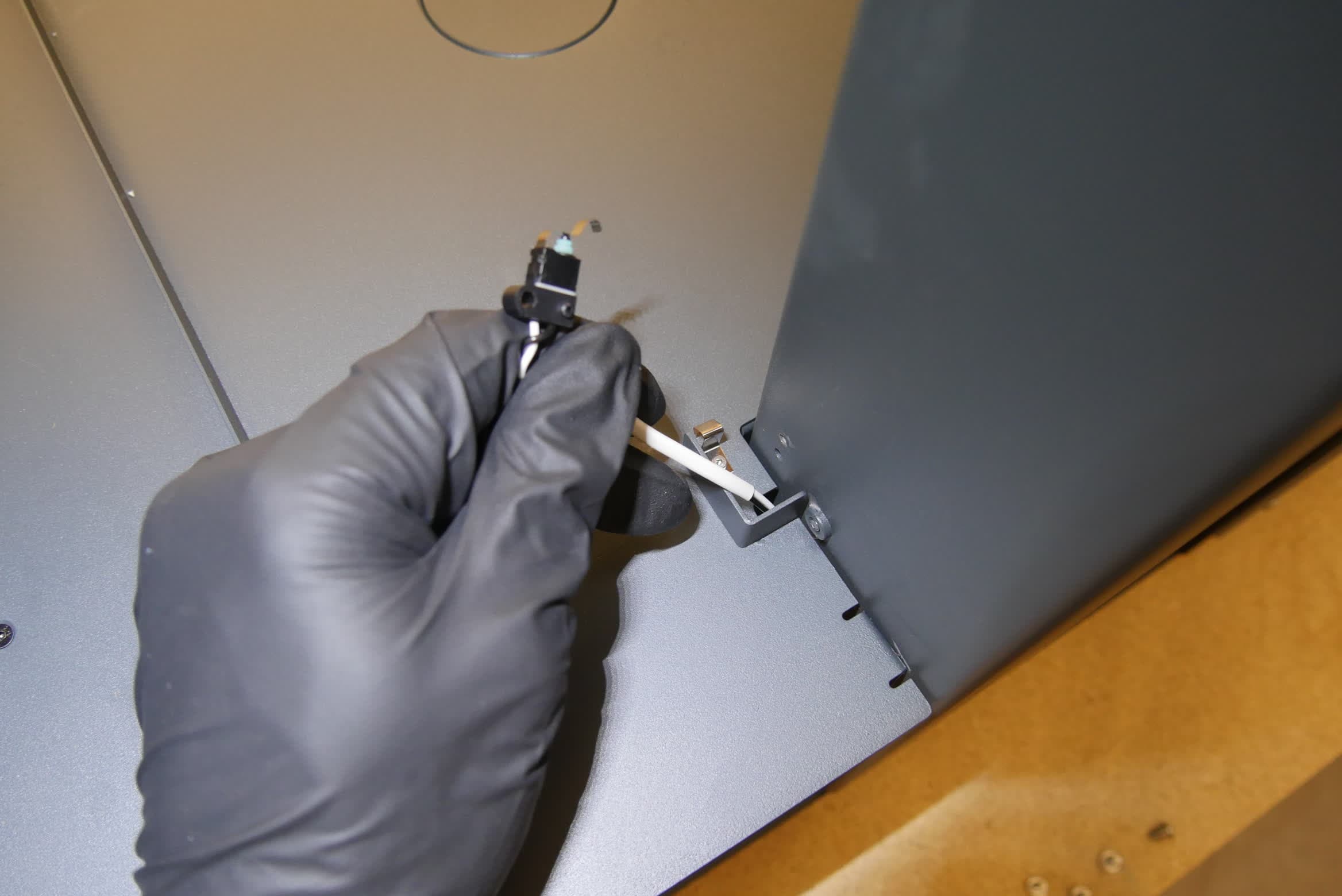 Mounting the replacement wash bucket interlock switch