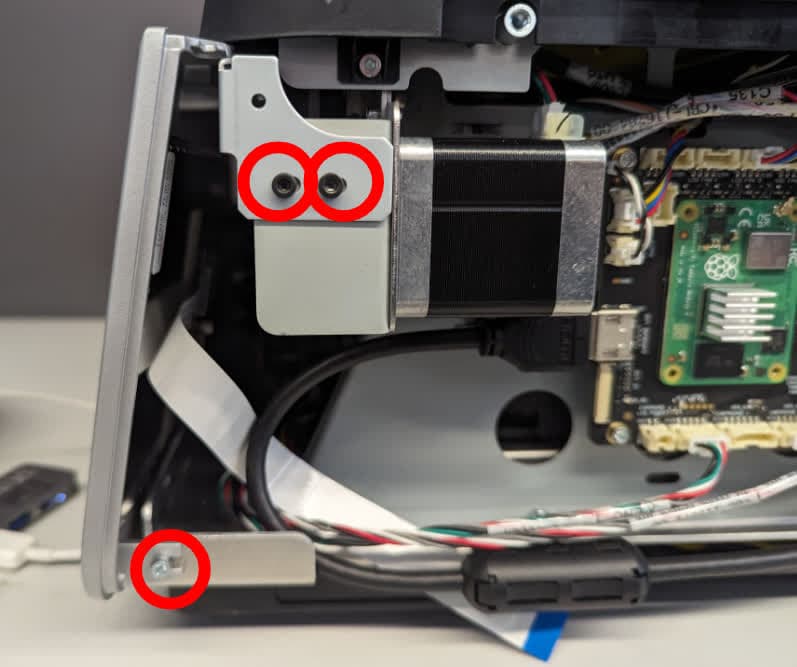 Step 6: Remove the right touchscreen assembly retention screws