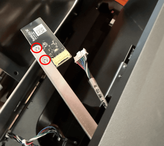 Remove the resin cartridge RFID board retention screws