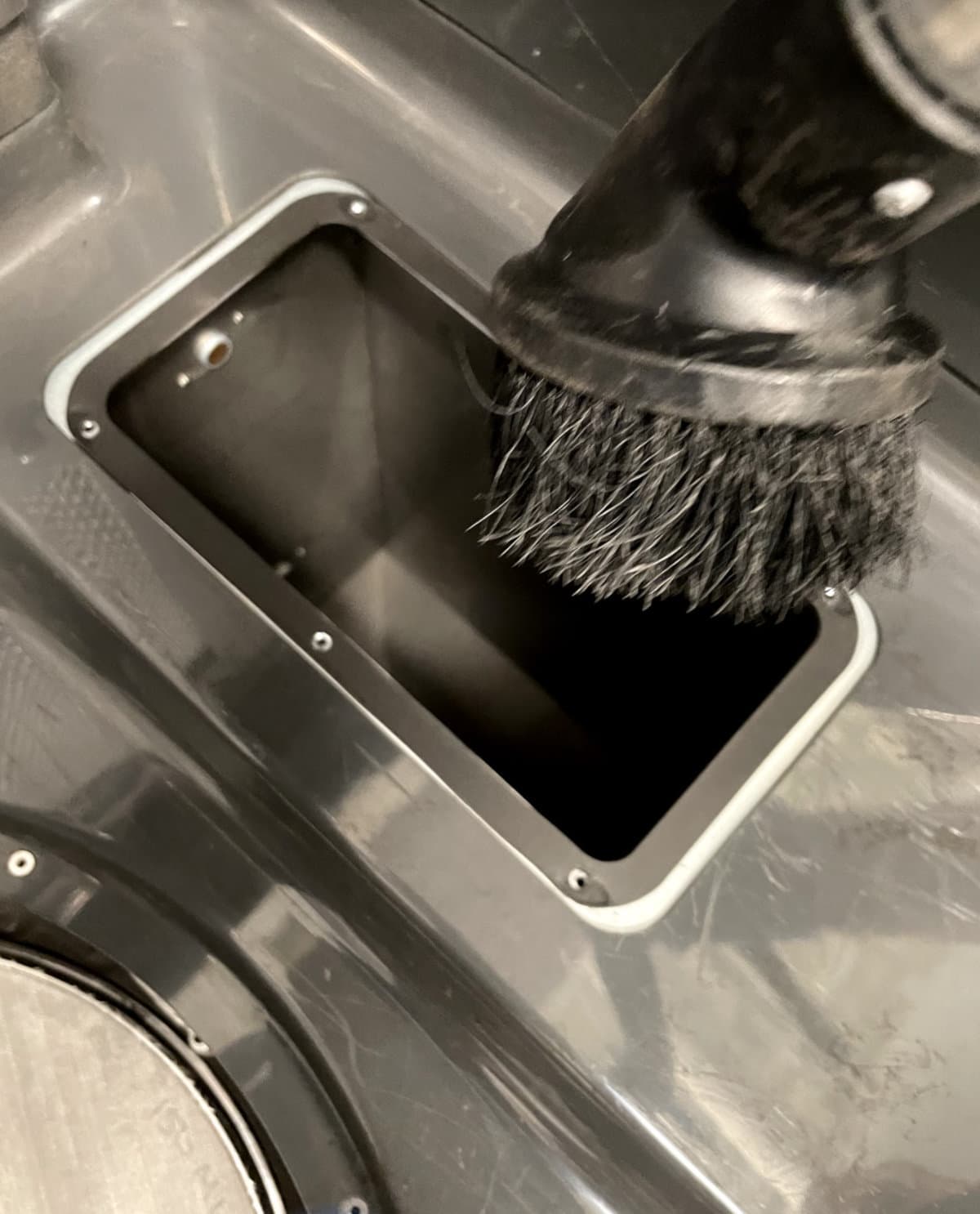 Vacuuming the fresh powder hopper