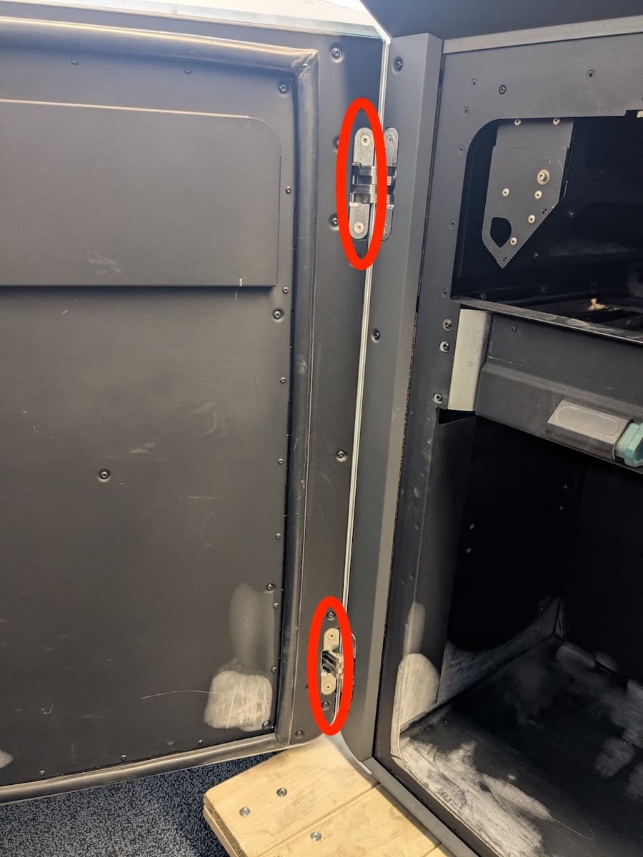 Step 1: Remove the hinge mounting screws from the door