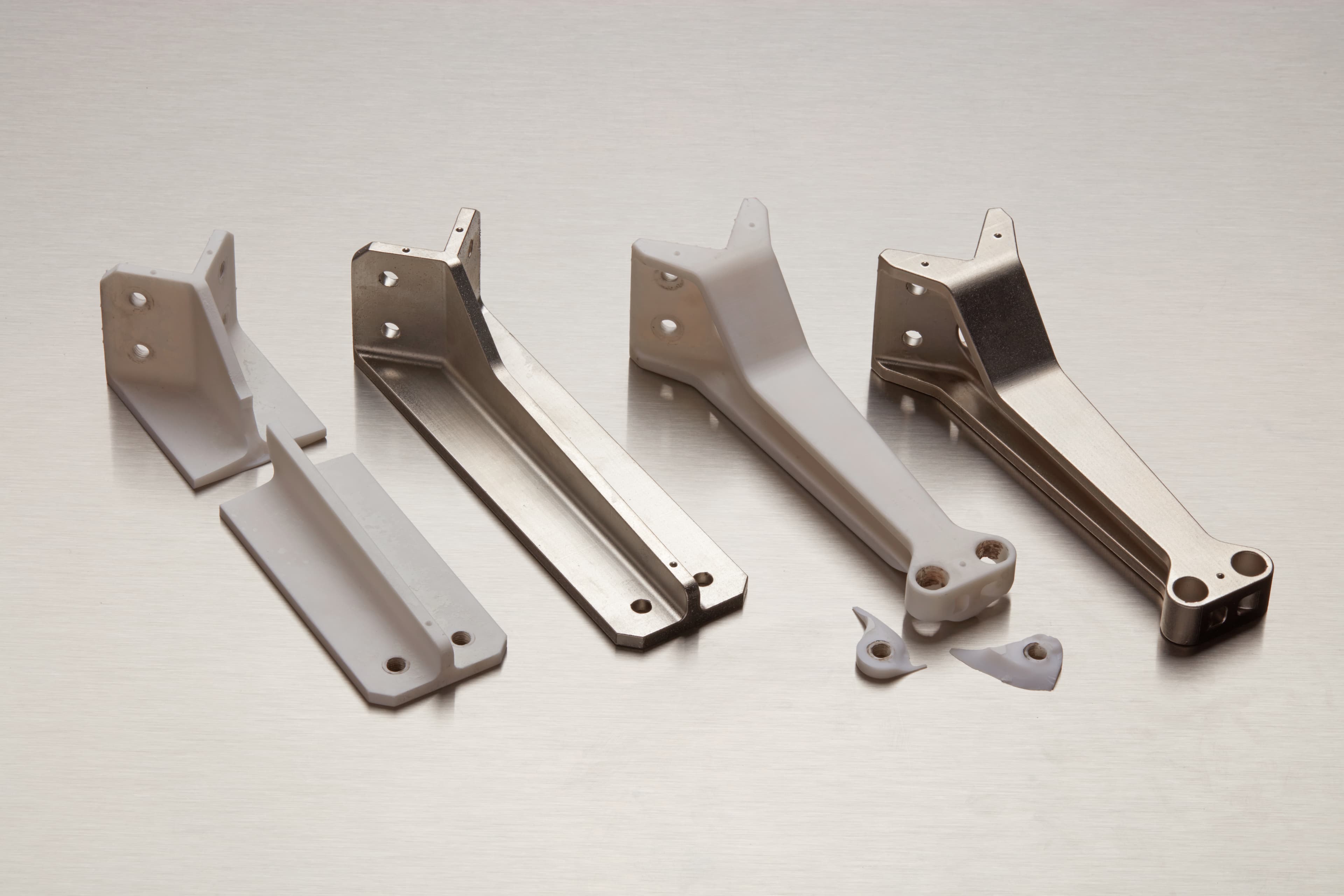 four brackets, two electroplated, one just resin and broken