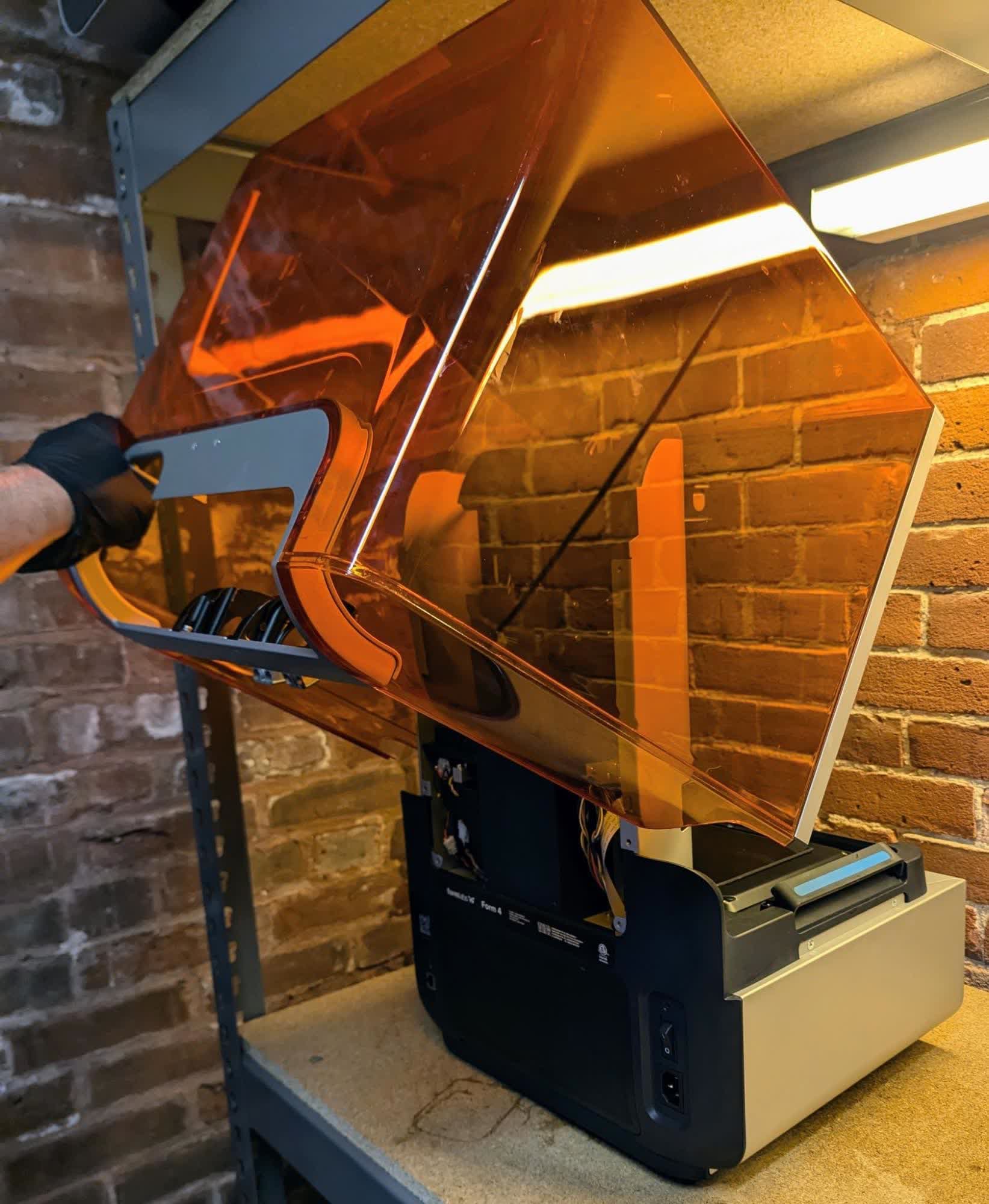 Sliding the Form 4 cover away from the printer
