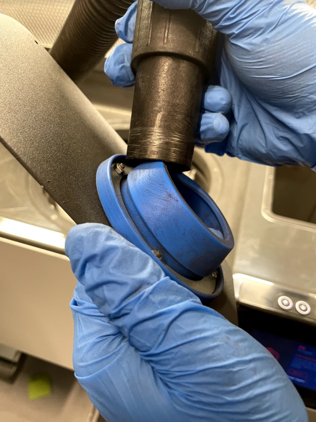 Vacuuming the inside of the fresh powder hopper lid