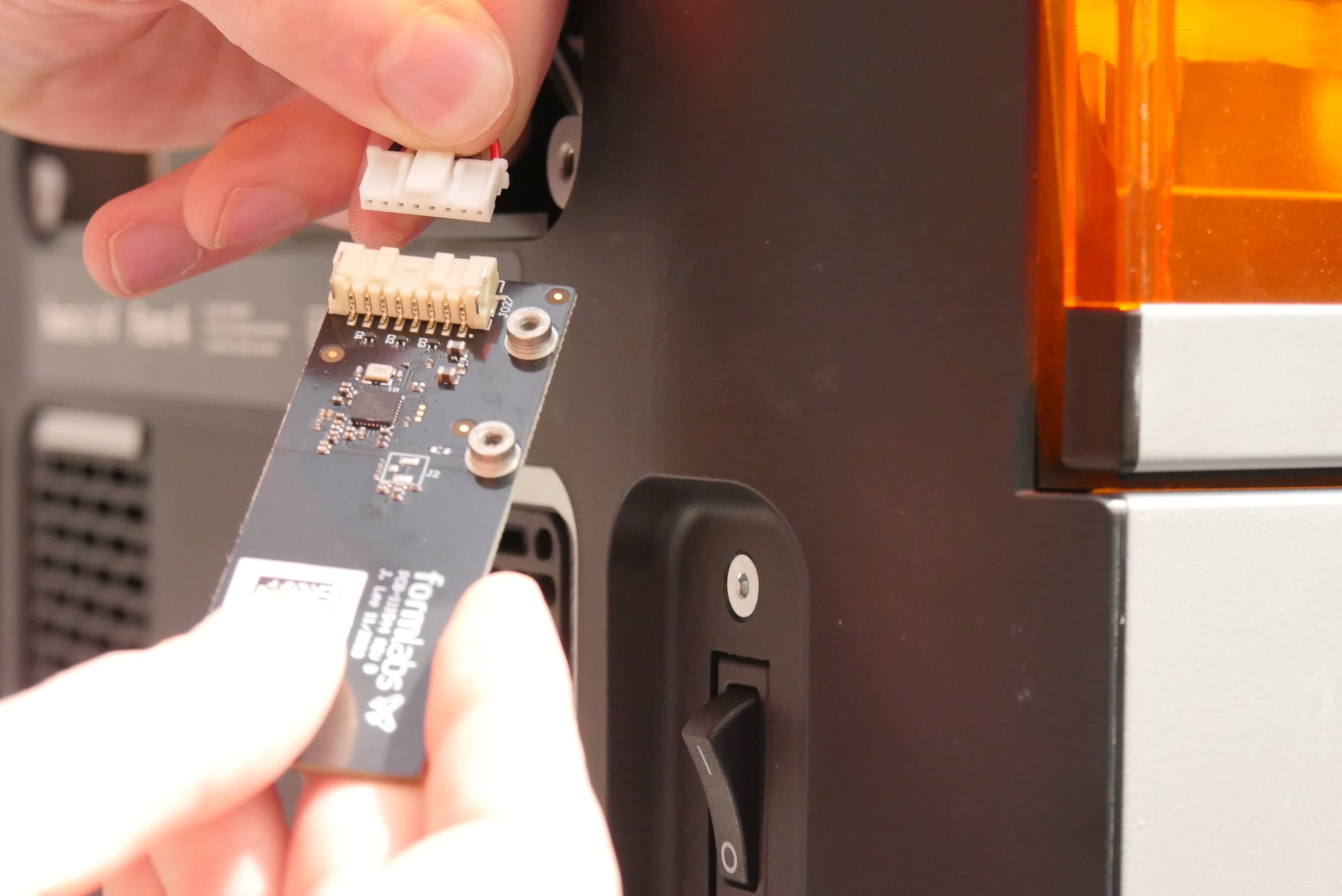 Disconnect the resin tank RFID cable