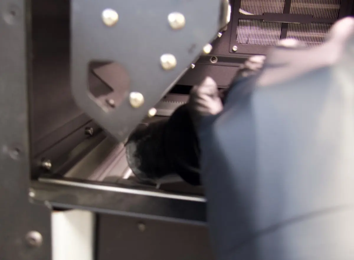 Vacuuming the left powder trough