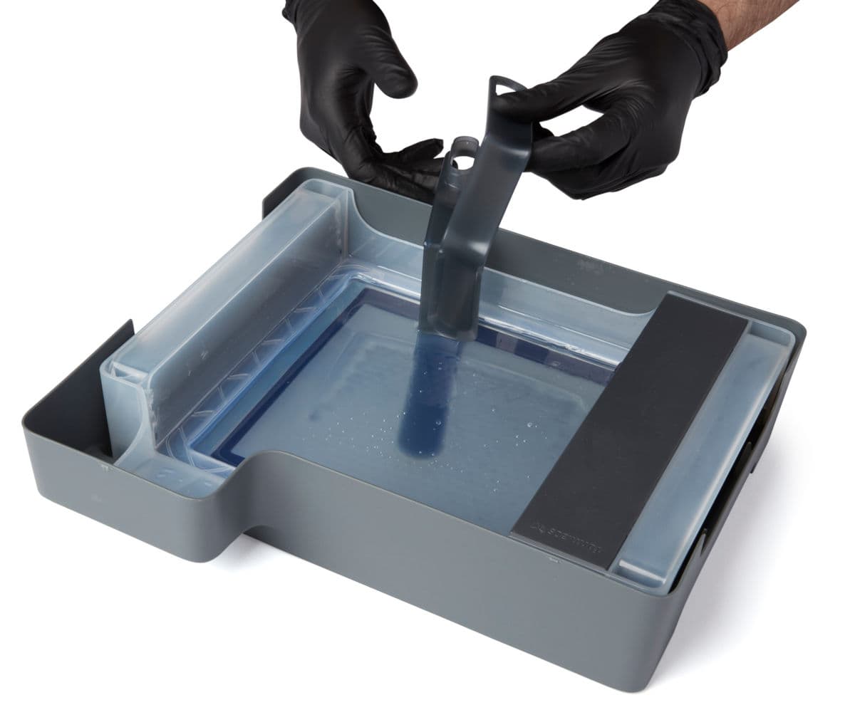Tweezing cured resin with the tank tool