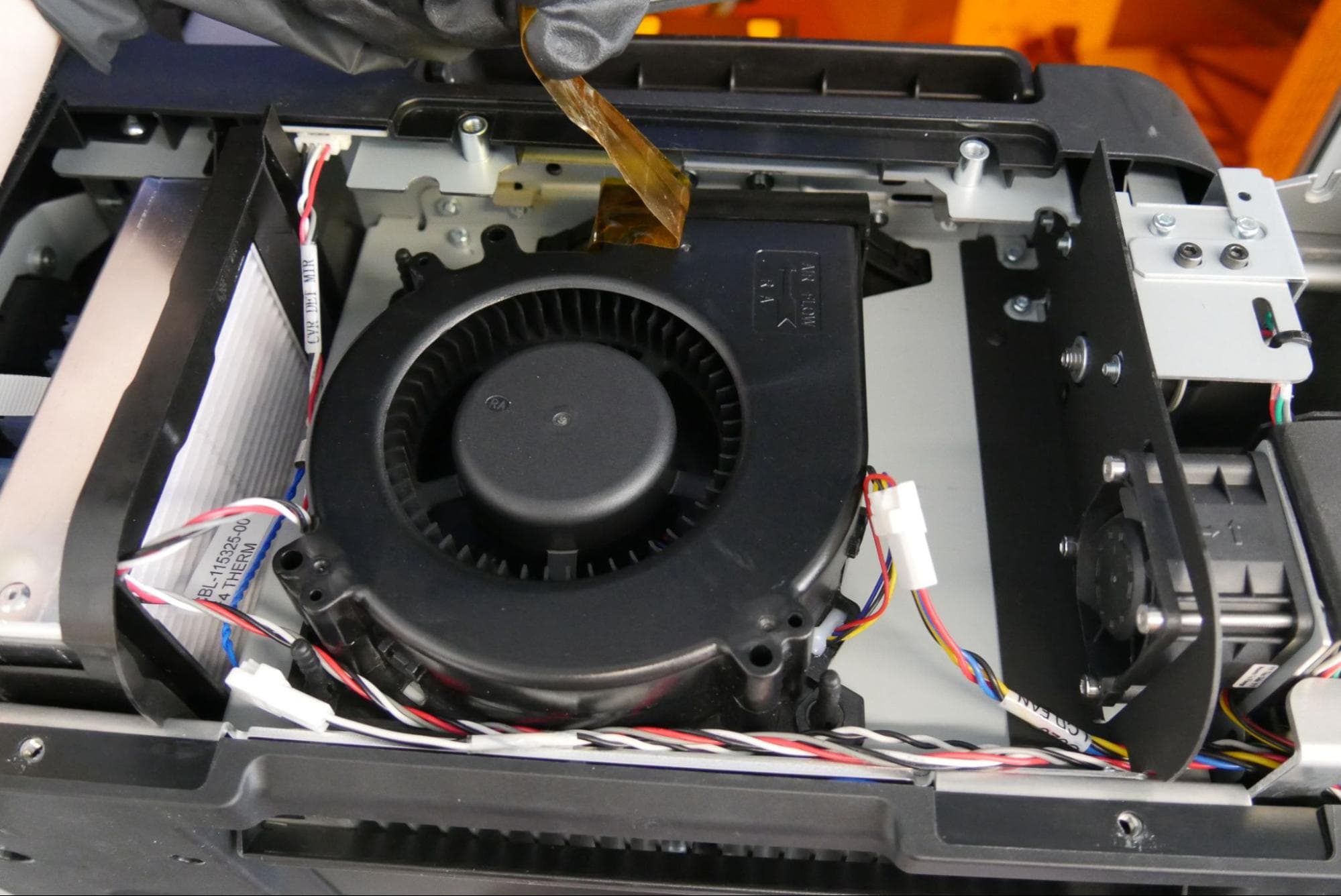 Carefully removing the tape from the Form 4 LPU fan