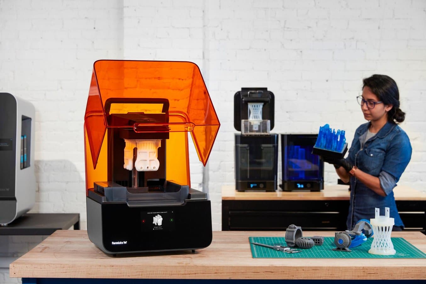 Woman Operating a Form 3+ Desktop 3D Printer