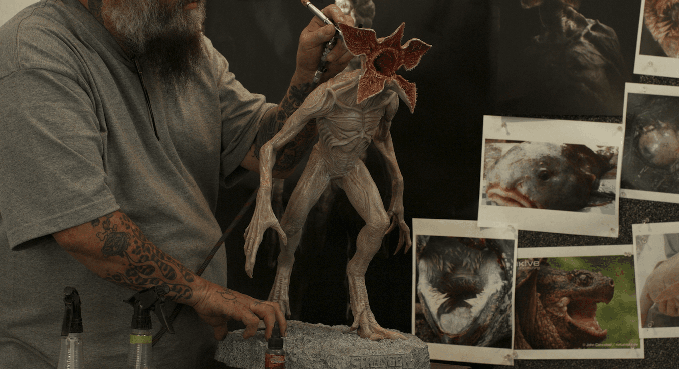 Traditional painting and finishing techniques are used on the final maquette before presenting to directors.