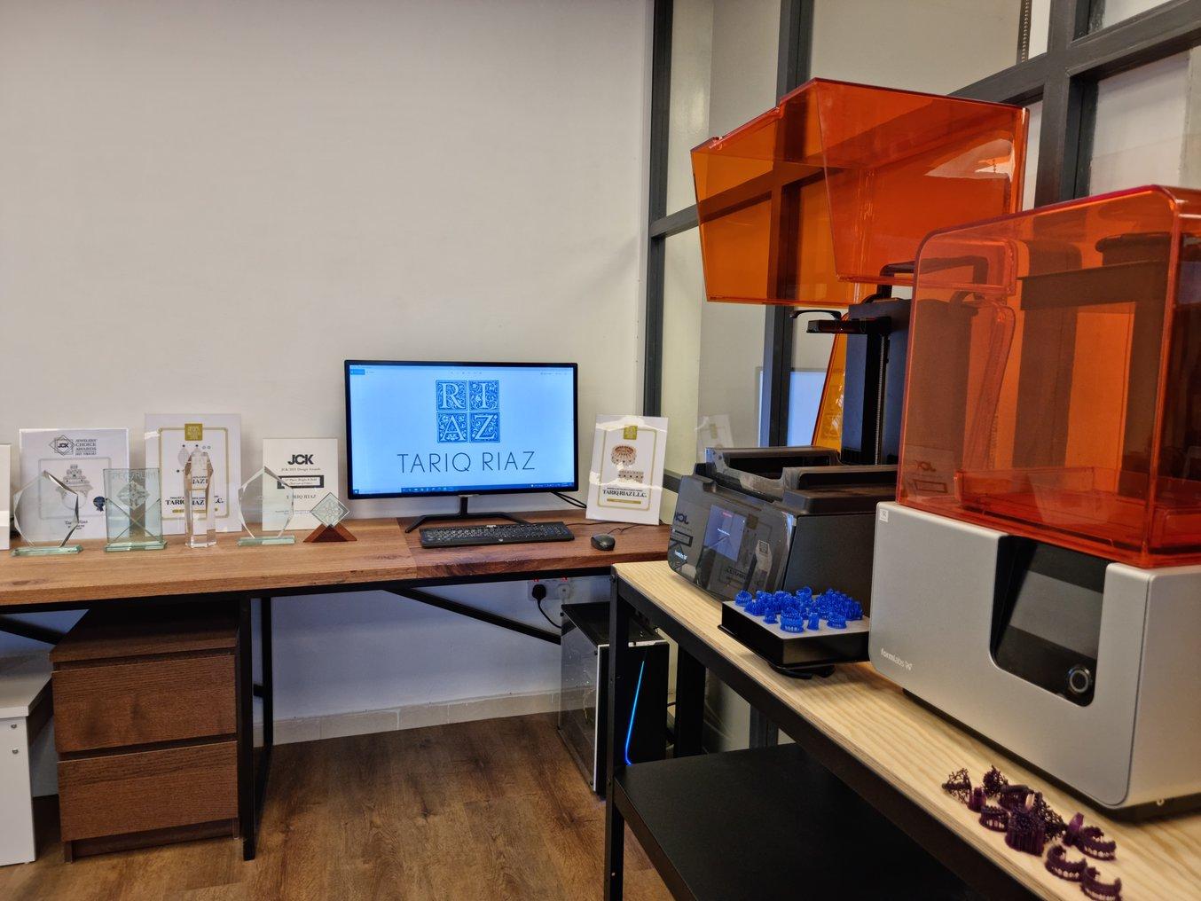 Riaz's workshop features several Form 3 SLA 3D printers and a variety of resins.