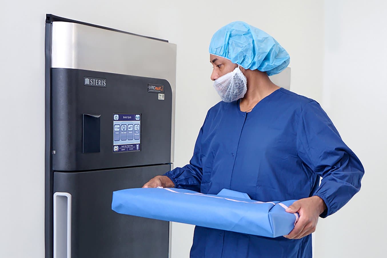 Person in front of STERIS' V-PRO Low Temperature Sterilizer