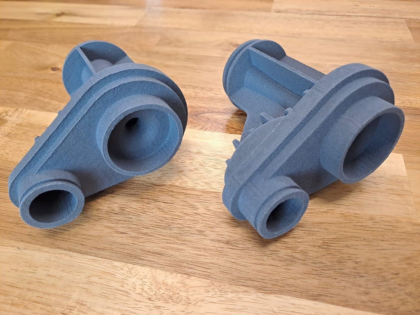 Two identical parts. The one at left is rougher.