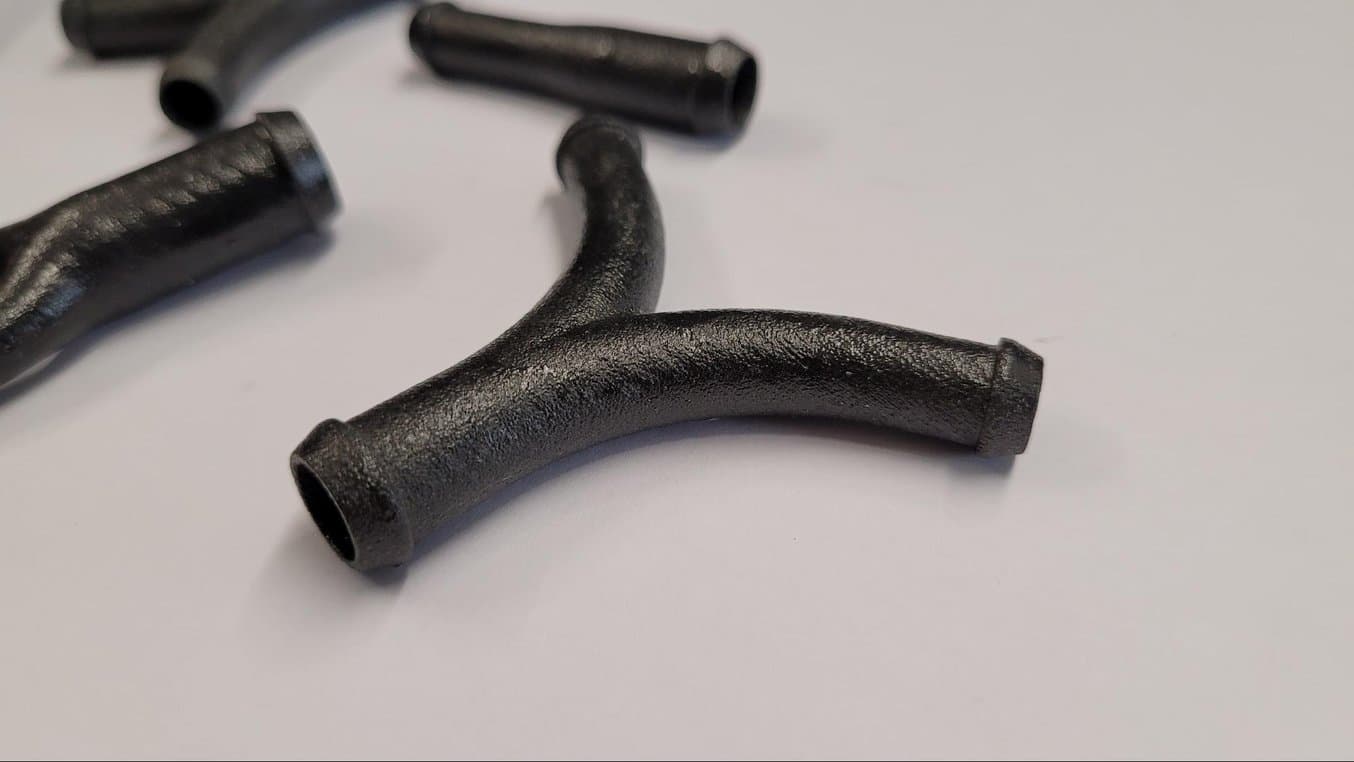 An SLS 3D printed and impregnated hose connectors for water cooling.