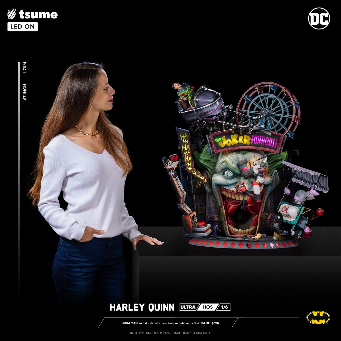 a woman stands next to a 3D statue