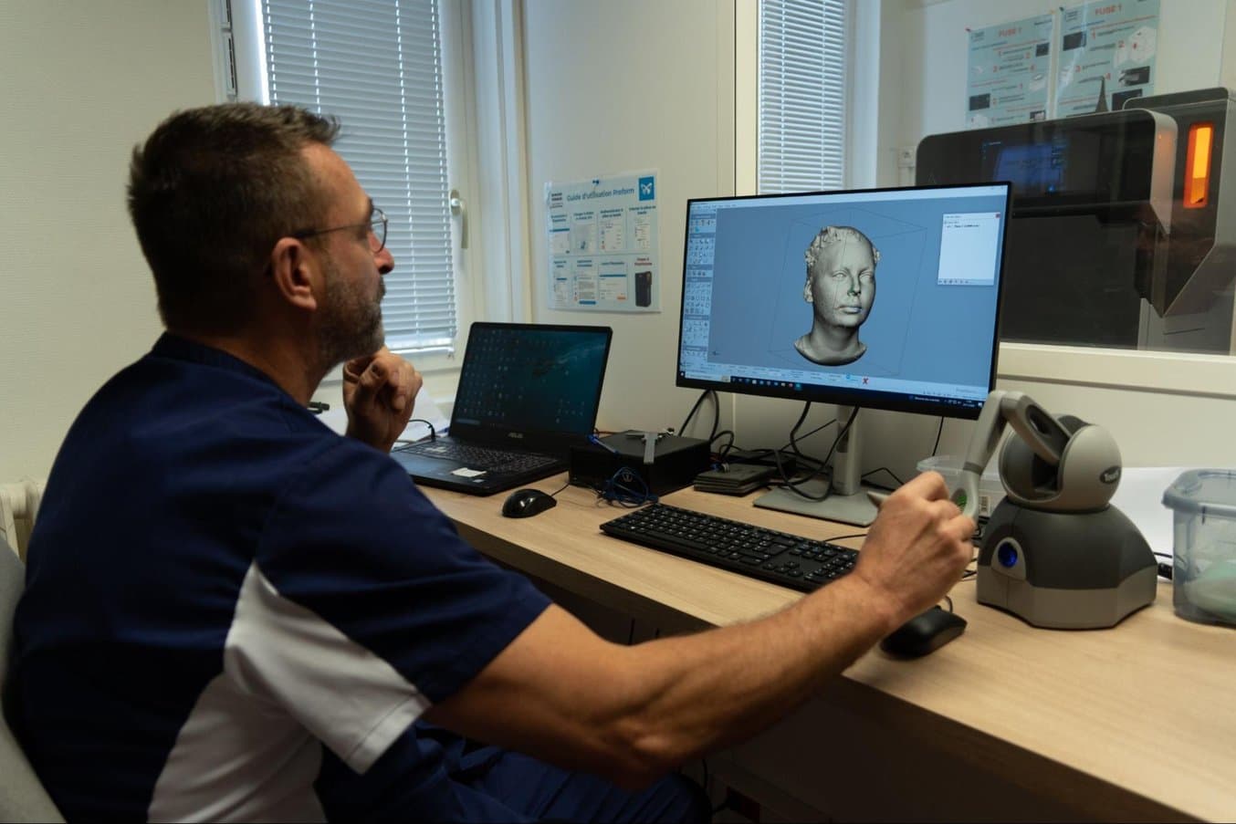 The orthoprosthetist uses a digital pen to precisely add the targeted reliefs to the design before creating a 3D printable model.